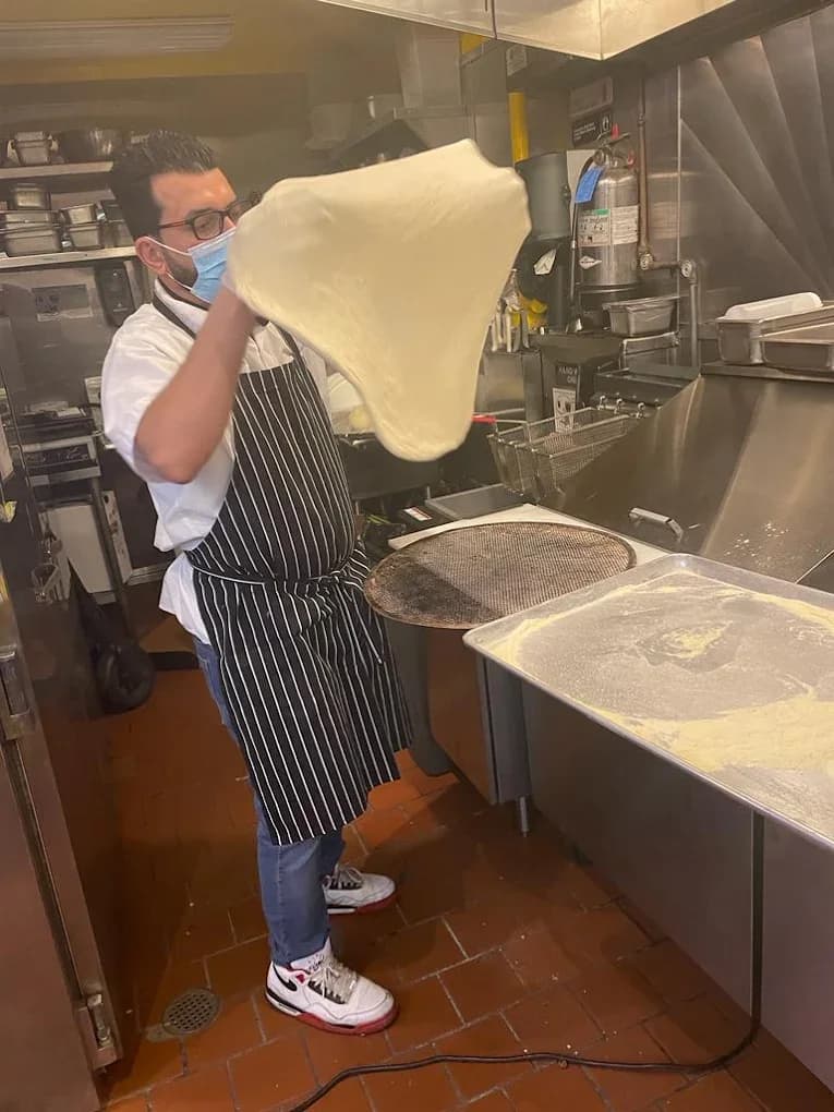 Hand-tossing fresh pizza dough in the San Francisco kitchen